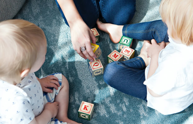 CHILD PLAYING WITH BLOCKS