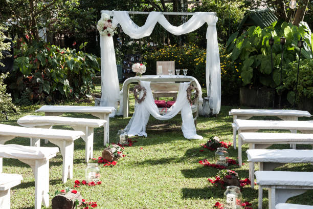 Wedding ceremony arch, altar decorated with flowers on the lawn