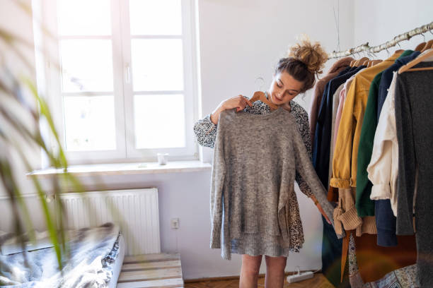 Young woman trying on clothes